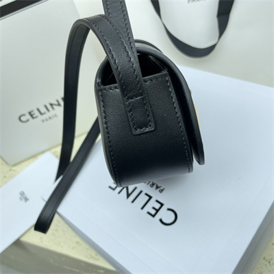 Ce**e clutch on strap tabou in smooth calfskin black