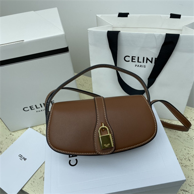 Ce**e clutch on strap tabou in smooth calfskin tan