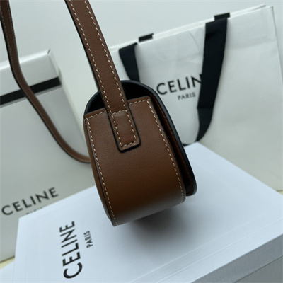 Ce**e clutch on strap tabou in smooth calfskin tan