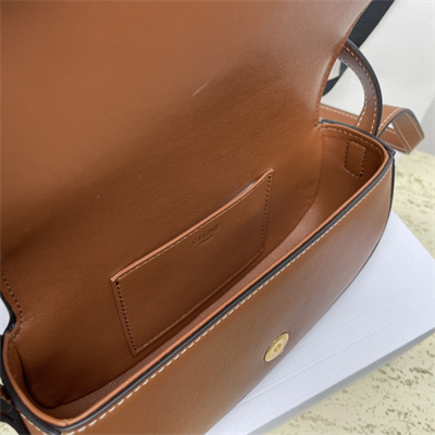 Ce**e clutch on strap tabou in smooth calfskin tan