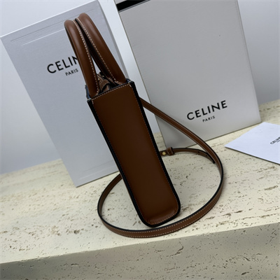 Ce**e mini vertical cabas in denim with  Ce**e all over print navy/tan