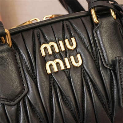 M*um*u arcadie matelassé nappa leather top handle bag black color