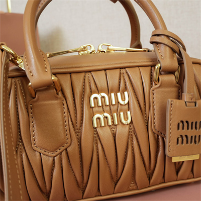 M*um*u arcadie matelassé nappa leather top handle bag caramel color